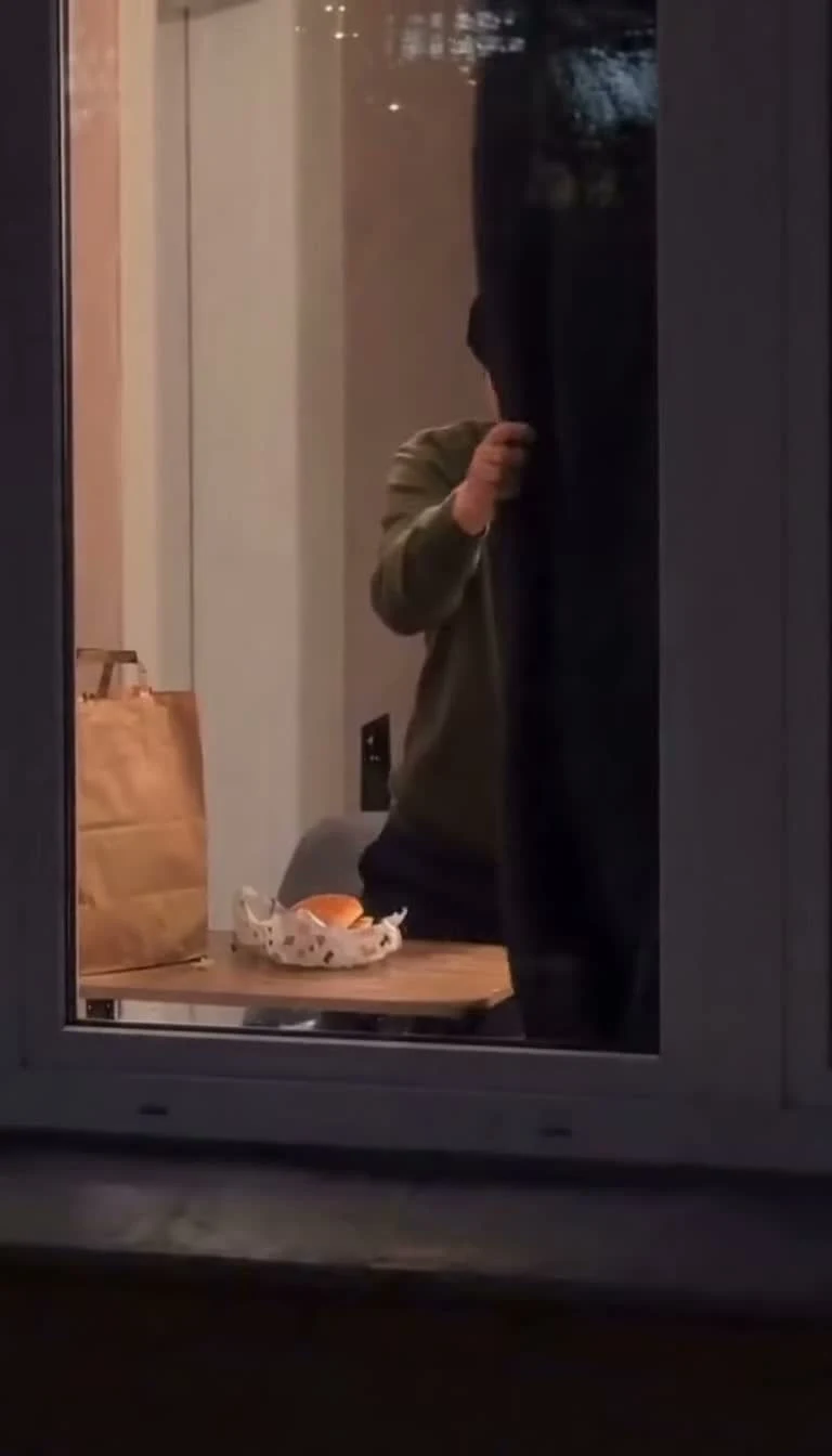 The window character reaching toward the curtain at the end of the snack scene