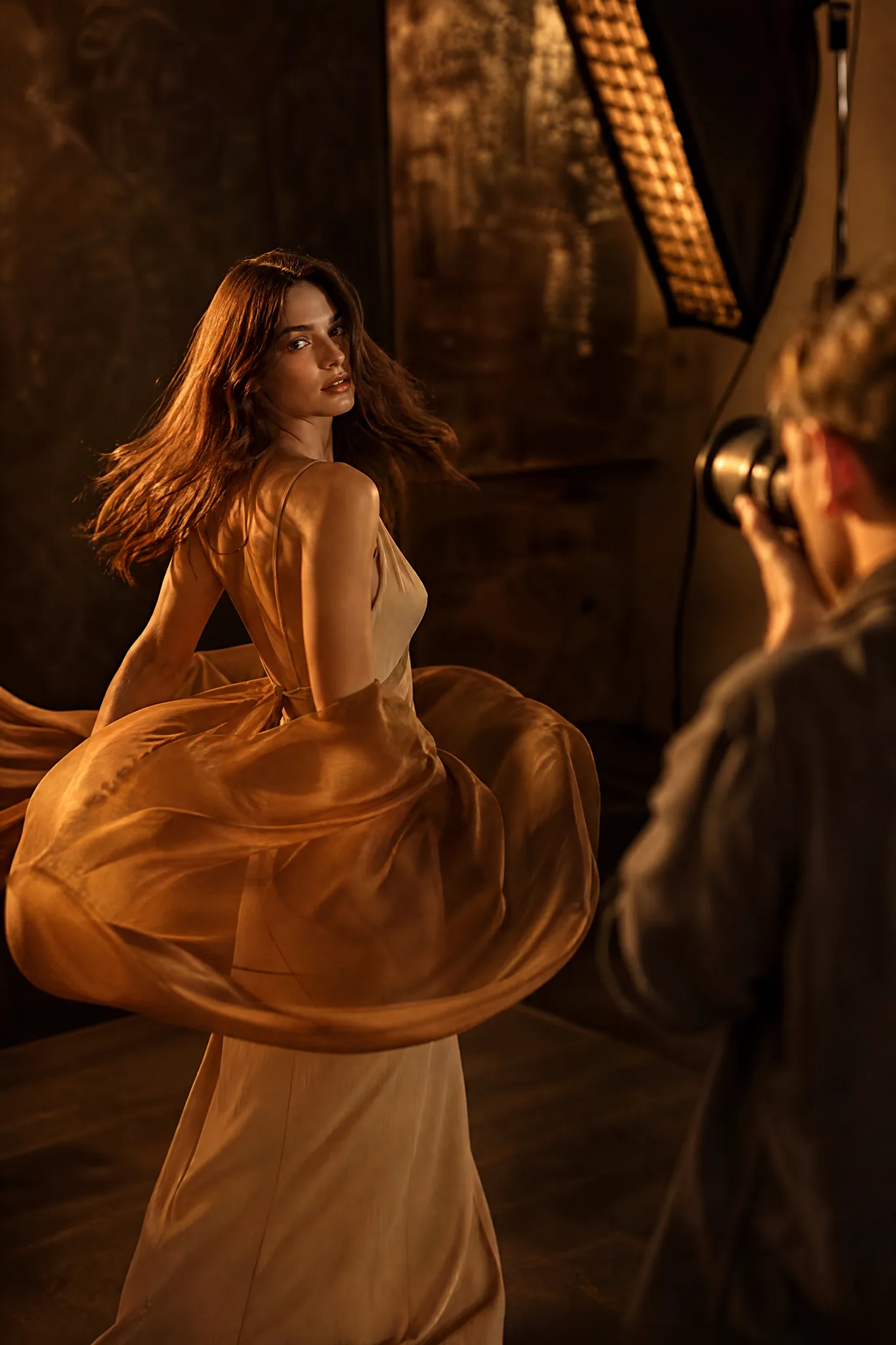 Z-Image Turbo: Another Take Model spinning in swirling amber silk while a photographer captures another take